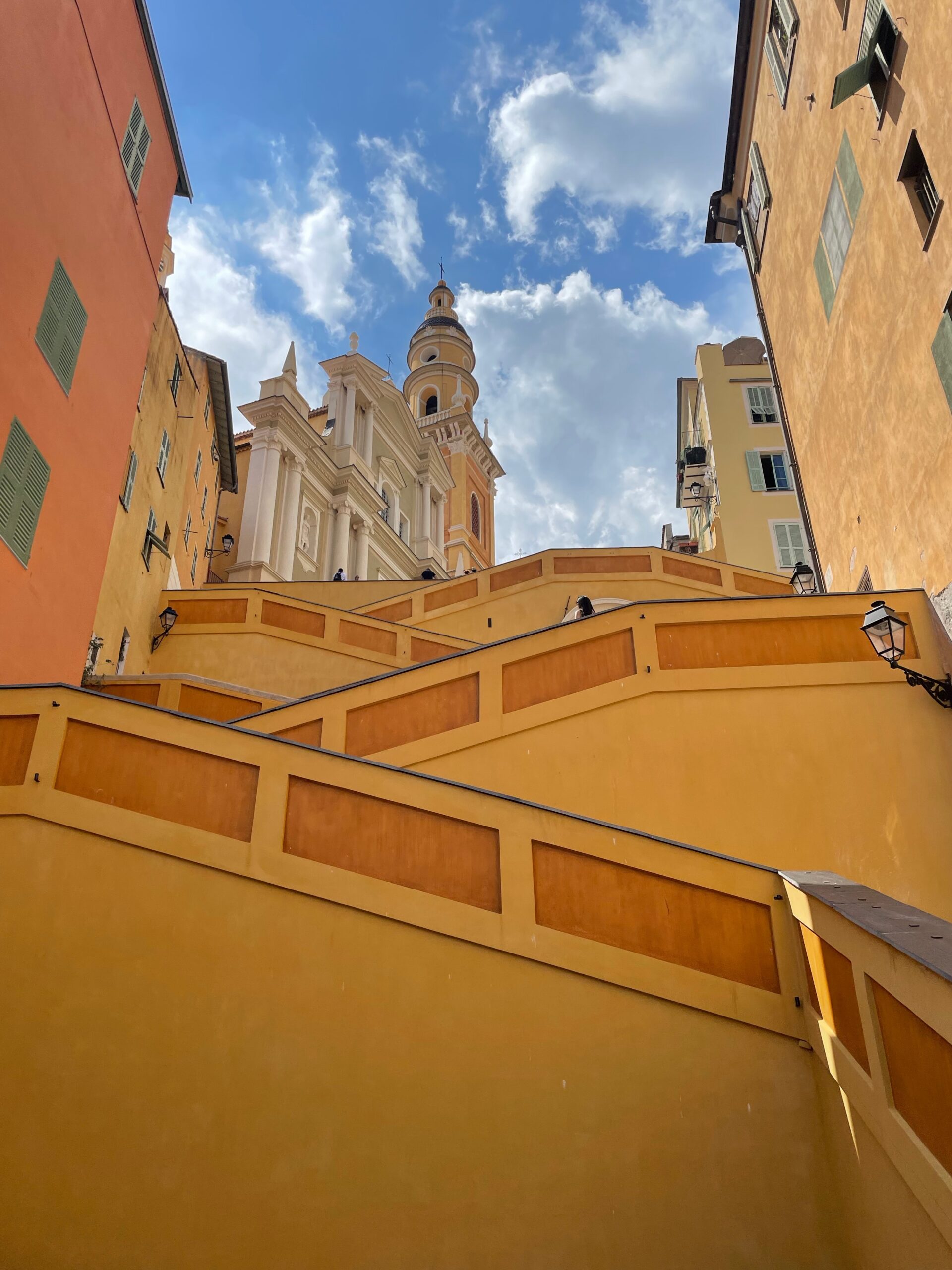 A Very Tall Building With a Clock Tower in the Background