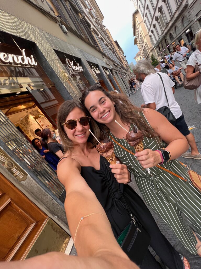 A Couple Women Standing Next to Each Other